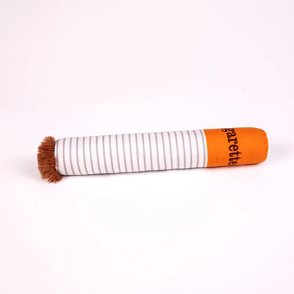 Funny cigarette pack plush dog toy held by a cute puppy